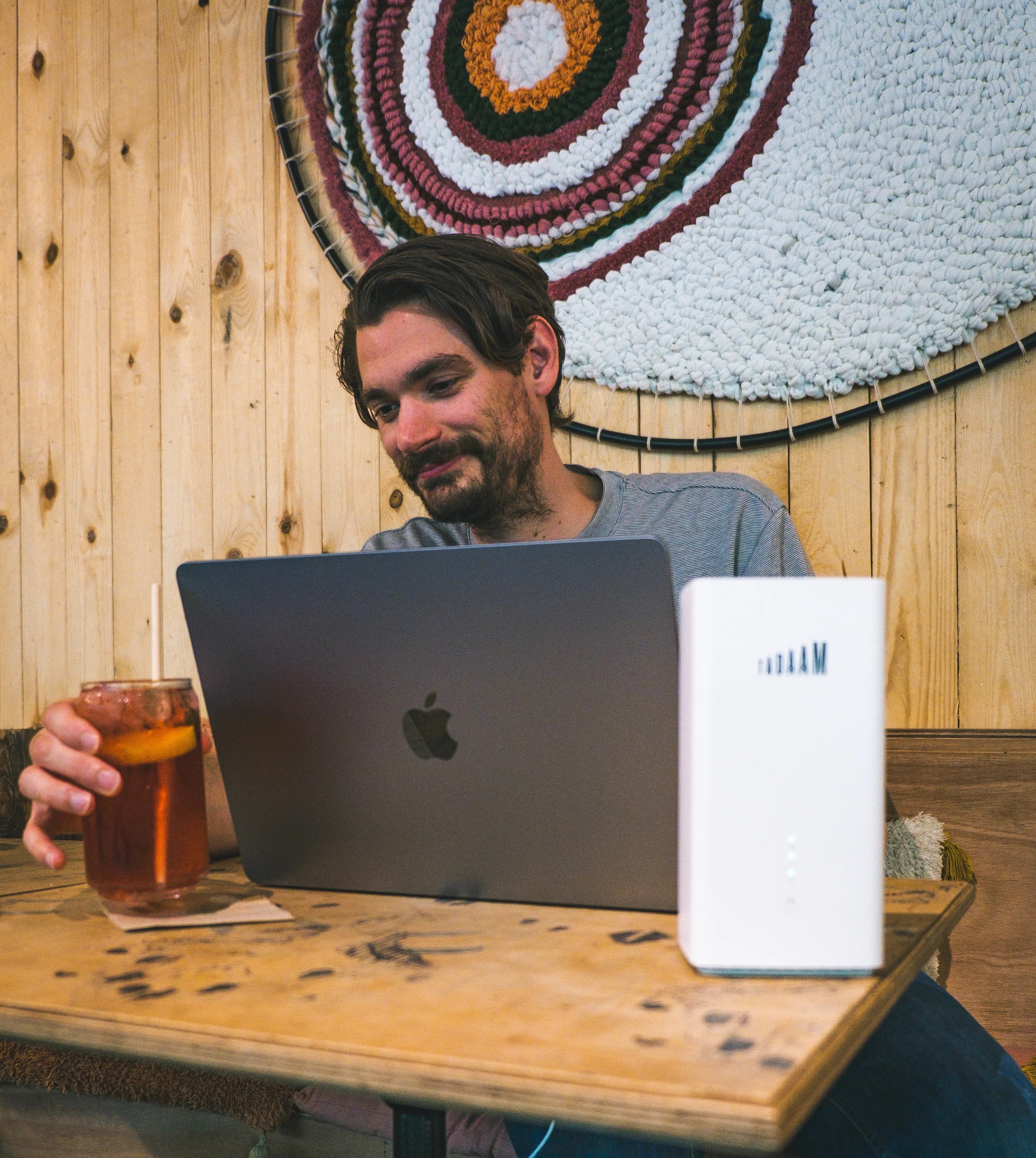 Guy in front of his laptop using TADAAM modem.